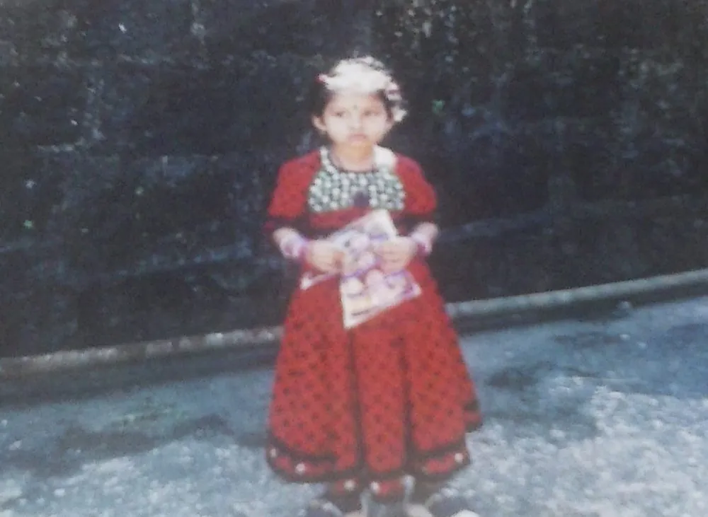 Little Saiee in a red dress